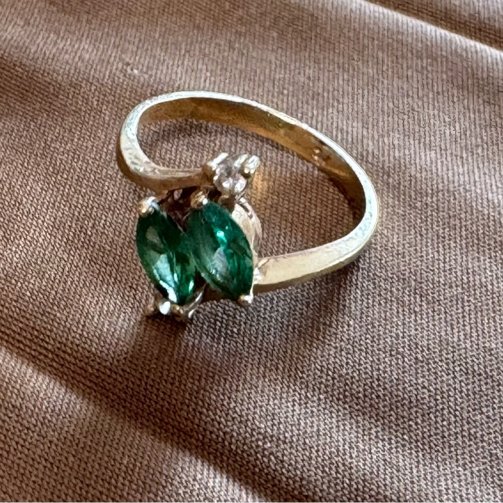 Elegant Gold Ring with Green Gemstones